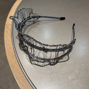 Detail of beaded grey mesh headband with crystals and vintage woven texture design