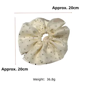 Detail of oversized double-layer mesh hair scrunchie with pearls and black dots, 20cm size