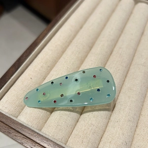 Elegant mint green resin hair clip with colorful crystals and silver metal clamp