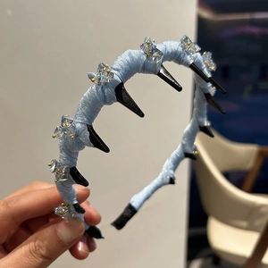 Light blue mesh wavy headband for women with teeth and sparkling crystal embellishments