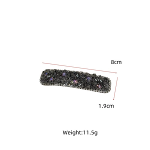 Detail view of a luxury rhinestone hair clip with dimensions 8cm by 1.9cm and 11.5g weight