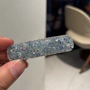 Detailed view of luxury square hair clip with blue crystals and sparkling rhinestones