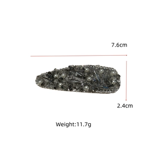 Detail view of the rhinestone hair clip dimensions showing 7.6cm length and 2.4cm width