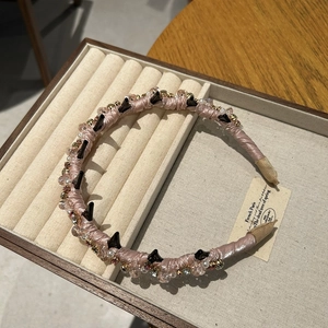 Elegant beaded crystal headband with pink satin finish and non-slip tooth design