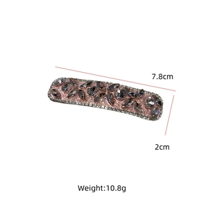 Detail view of pink rectangular hair clip with rhinestones, 7.8cm size specifications