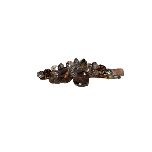 Elegant duckbill hair clip featuring amber crystal beads and a metallic base design