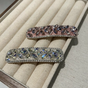 Detailed macro view of heart shape rhinestone BB hair clips with crystal inlay detail