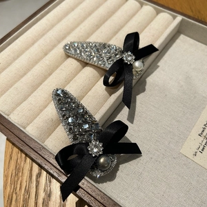 Sparkling rhinestone bow hair clips in silver and charcoal gray with elegant faux pearls