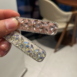 Set of two luxury heart rhinestone hair clips with pink and iridescent crystal stones