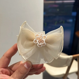 Elegant beige mesh bow hair clip with white pearl flower beadwork for women