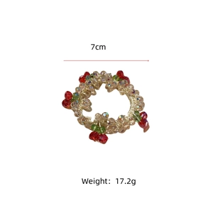 Detail view of champagne crystal beaded hair tie with red cherry charms and size measurements