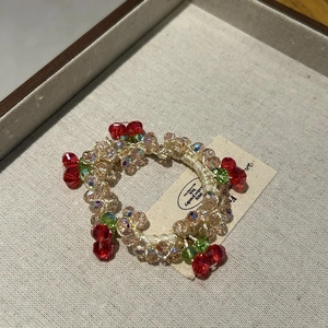 Elegant beaded cherry bracelet hair tie with red crystal beads and woven strap