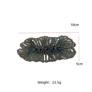 Detail of beaded hair clip showing precise dimensions 10cm by 5cm and 23.5g weight