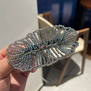 Luxury woven crystal hair clip with iridescent beads in a fan-shaped vintage style