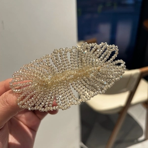 Handcrafted woven crystal hair clip featuring champagne beads in a fan-shaped design