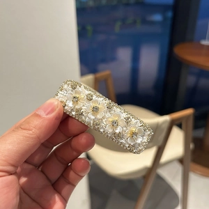 Elegant gold metal flower hair clip with pearls and rhinestones for women