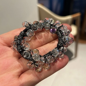 Elegant hand-held crystal beaded elastic hair scrunchie with faceted clear beads