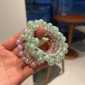 Jelly color beaded hair ties in mint green and lavender with silver glitter elastic
