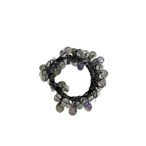 Elegant beaded hair scrunchie with iridescent crystal beads on a black elastic band