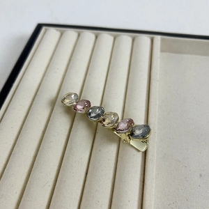 Elegant gold hair clip with sparkling champagne and purple crystals for women