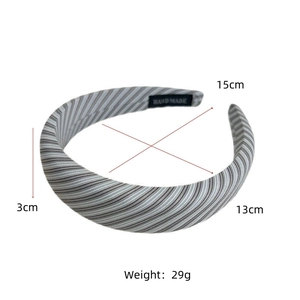 Detail view of the handmade striped fabric headband with high-quality stitching texture