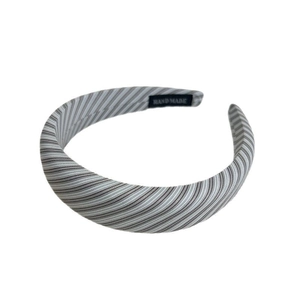 Handmade striped headband in mint green and white fabric with a high-quality hand-made label