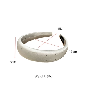 Detail view of satin padded headband showing dimensions 15cm width and 3cm thickness