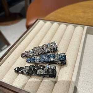Three-piece luxury rhinestone duckbill hair clips in pink, blue, and charcoal grey set