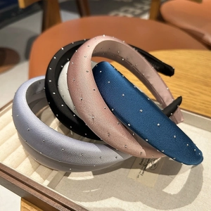 Padded satin headbands set with rhinestones in light blue, black, pink, and navy blue