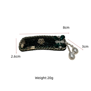 Detail view showing dimensions of vintage emerald rhinestone hair clip with pearls