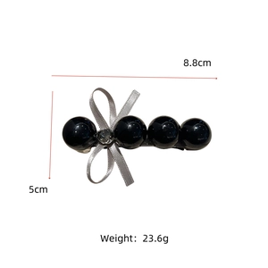 Détail montrant les dimensions du nœud: 8,8 cm de long, 5 cm de haut, poids de 23,6 g