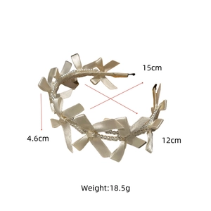 Detailed size view of cream satin bow and pearl headband with measurements in centimeters