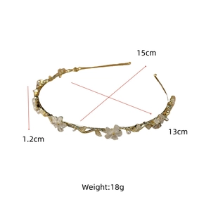Détails du serre-tête fleurs dorées indiquant les dimensions de 15 cm sur 13 cm