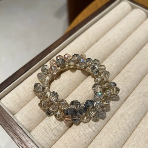Elegant beaded hair tie with gradient crystal glass beads in neutral champagne and grey tones