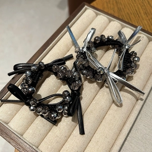 Elegant beaded hair tie with black leather bow and faceted obsidian crystal beads
