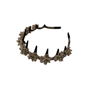 Elegant dark grey crystal flower headband with punk style black spikes and gold details