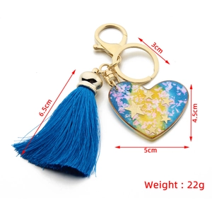 Detailed dimensions of heart resin keychain with blue tassel and gold metal hardware