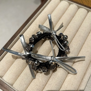 Elegant beaded hair tie featuring dark obsidian crystals and silver bow decorations