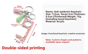 Detailed view of the 7x3cm acrylic EDC door opener keychain with pink floral pattern and tassels
