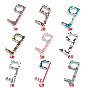 Detail showing nine different floral and patterned acrylic EDC door openers in a grid layout