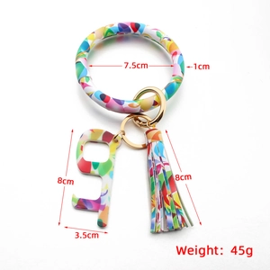 Colorful PU leather bracelet keychain set with printed patterns and matching tassel charm