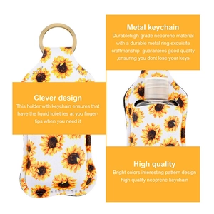 Detail showing durable neoprene sunflower sleeve with metal keyring for hand sanitizer bottles