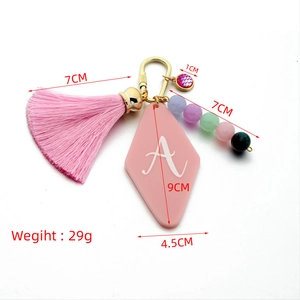Pink acrylic geometric diamond keychain with letter A charm and soft tassel pendant