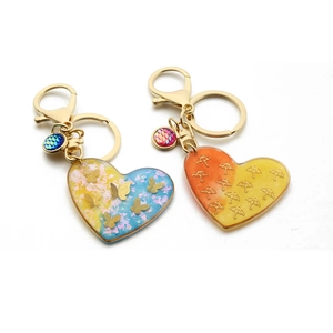 Handmade butterfly and umbrella resin heart keychains with golden tassel charms