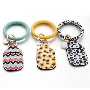 Portable 30ml hand sanitizer holder set with PU leather wristlet and floral patterns