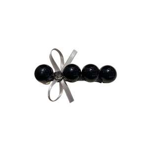 Barrette élégante en perles noires avec nœud argenté et strass étincelant