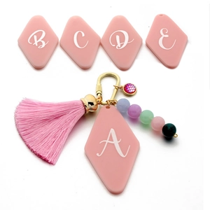 Custom initial A keychain with pink tassel, acrylic diamond charm and colorful beads