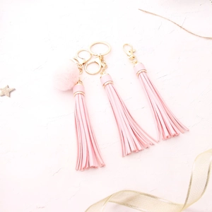 Pink PU leather tassel keychains with faux fur pom pom and gold lobster clasp
