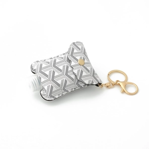 Portable PU leather hand sanitizer bottle holder with Goyard style Y-pattern and key ring