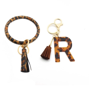 Leopard print PU leather bracelet keychain with tortoiseshell acrylic letter R and tassel